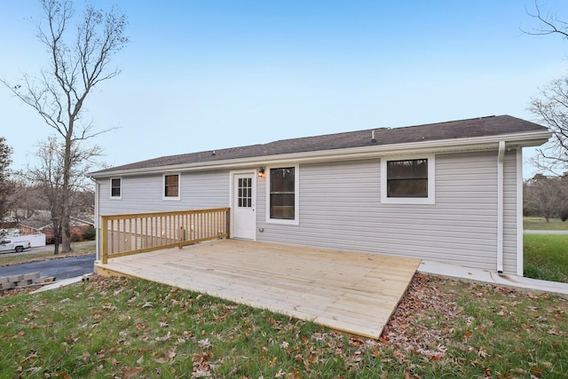 back of house featuring a wooden deck