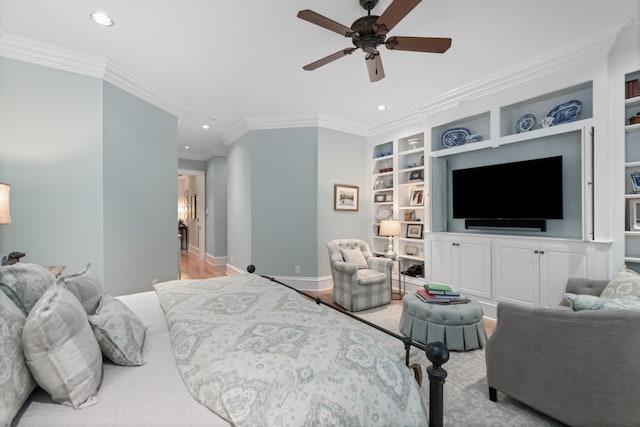 bedroom with ceiling fan, light hardwood / wood-style floors, and ornamental molding