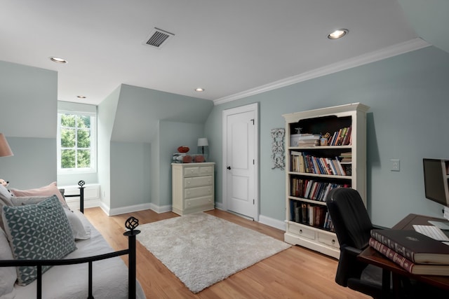 office featuring wood-type flooring, ornamental molding, and lofted ceiling