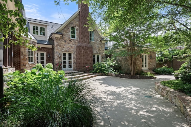 tudor-style house with french doors