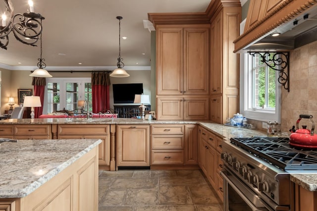 kitchen with high end stove, decorative light fixtures, ornamental molding, and custom exhaust hood