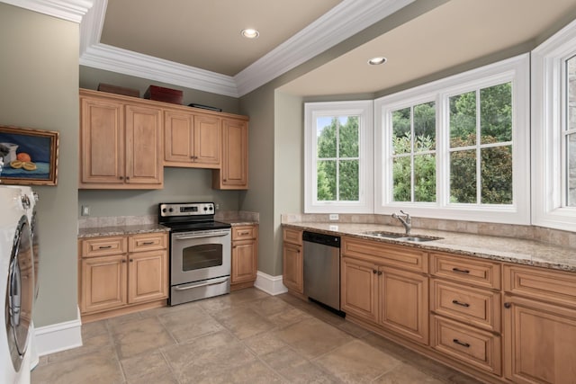 kitchen with light stone countertops, stainless steel appliances, crown molding, and sink