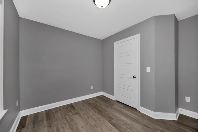 spare room with wood-type flooring