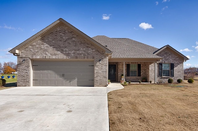 view of front of home featuring a garage and a front lawn