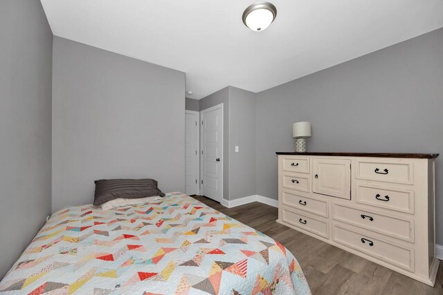 bedroom featuring dark hardwood / wood-style flooring