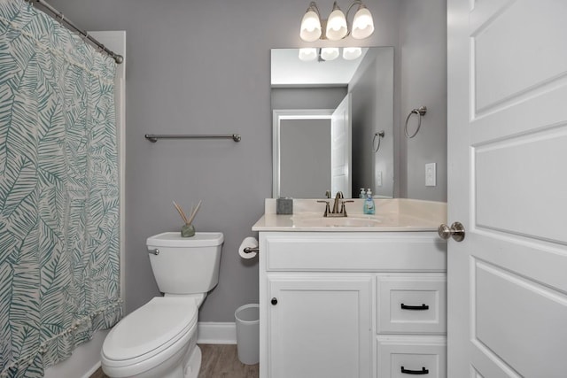 bathroom featuring hardwood / wood-style flooring, vanity, and toilet