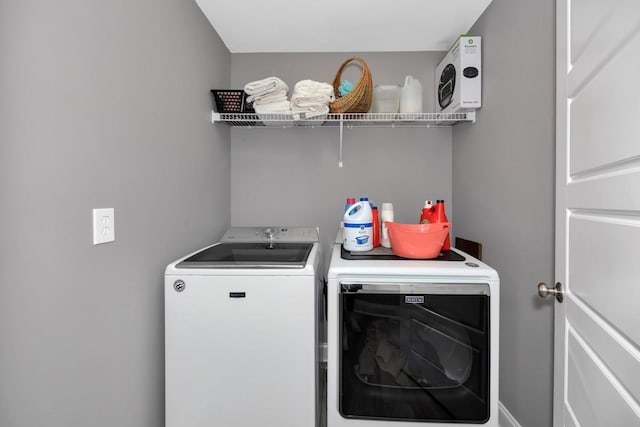 washroom with washer and clothes dryer