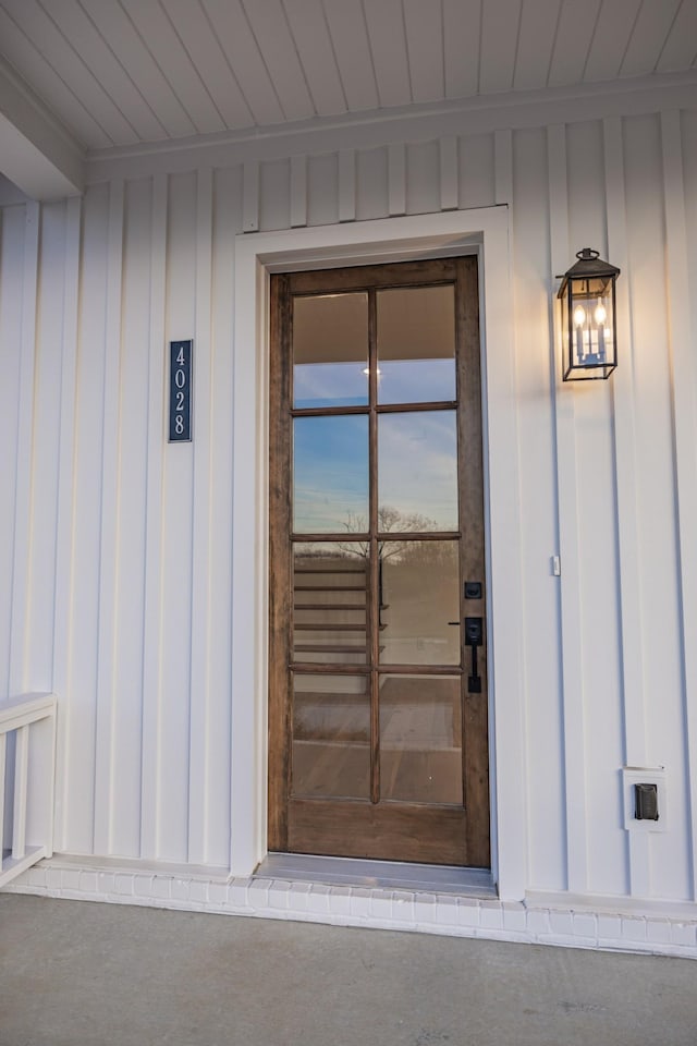 view of exterior entry at dusk