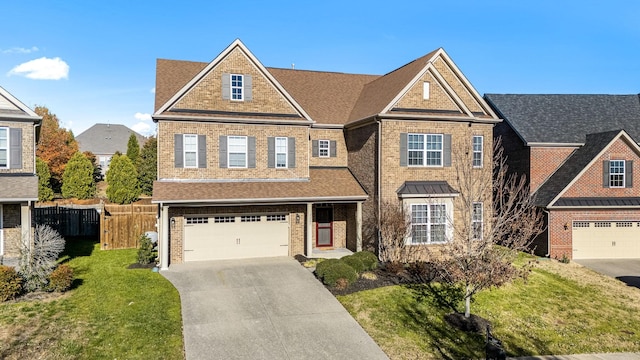 view of front of home featuring a garage and a front lawn