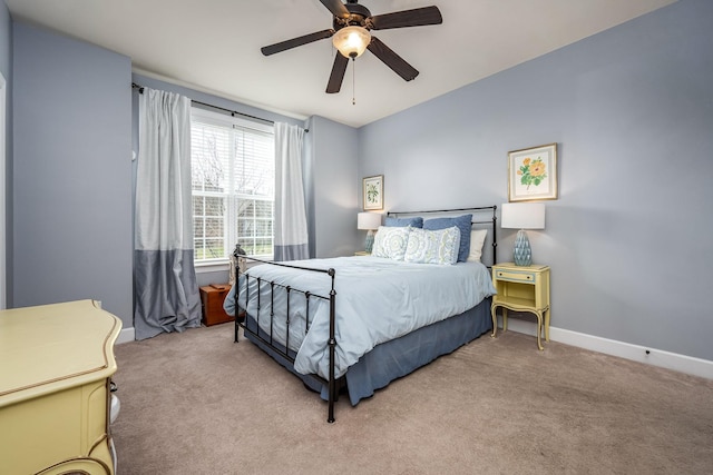 bedroom featuring ceiling fan and light colored carpet