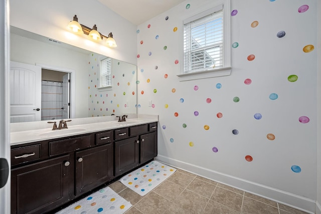 bathroom featuring tile patterned flooring and vanity