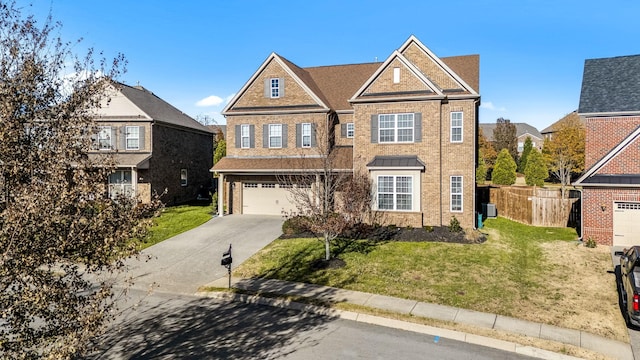 view of front of house with a garage and a front yard