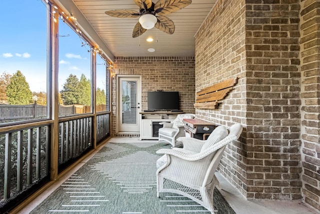 unfurnished sunroom with ceiling fan and wooden ceiling