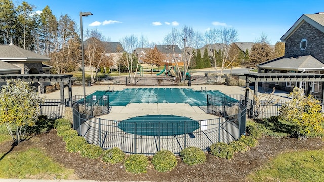 view of pool with a pergola and a patio