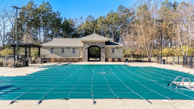 view of swimming pool with a patio