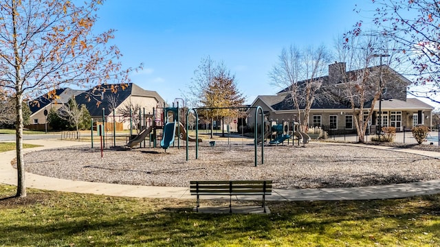 view of jungle gym featuring a lawn