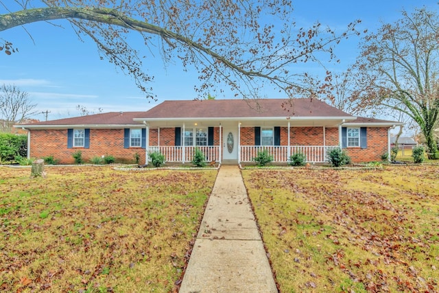 ranch-style home featuring a front yard