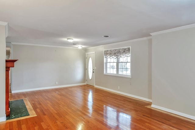 unfurnished living room featuring wood-type flooring and crown molding