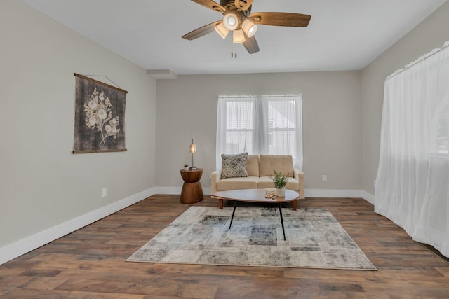 sitting room featuring ceiling fan and dark hardwood / wood-style flooring