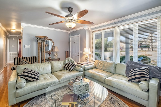 living room featuring crown molding, ceiling fan, and wood-type flooring