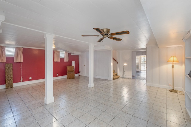 basement with ceiling fan and tile patterned flooring