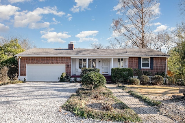 ranch-style house featuring a garage