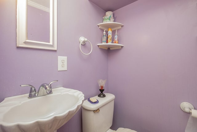 bathroom with toilet and sink