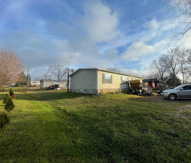 view of property exterior with a yard