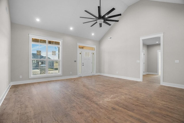 unfurnished living room featuring ceiling fan, baseboards, and wood finished floors