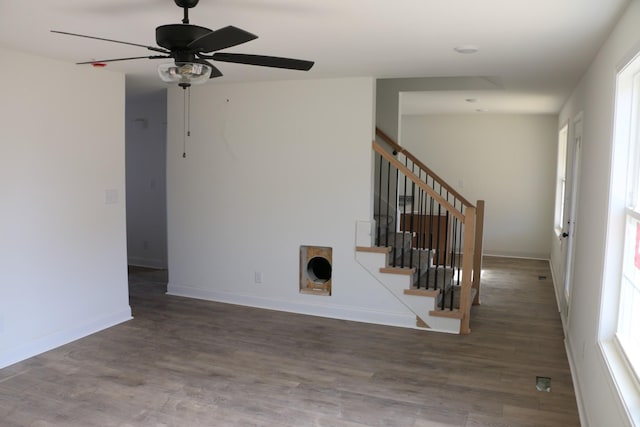 interior space with dark hardwood / wood-style flooring and ceiling fan