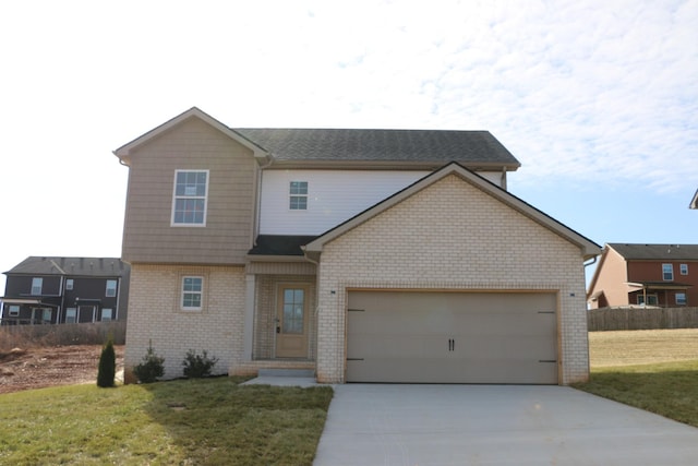 view of front facade with a garage and a front lawn