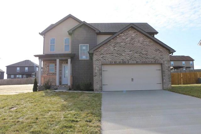 view of front facade featuring a front yard and a garage