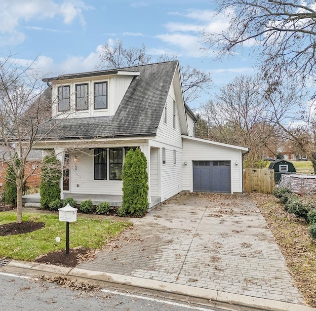 view of front of home with a porch and a garage