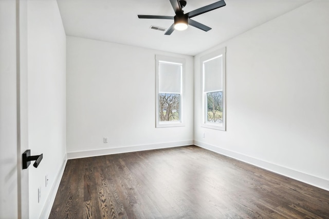 unfurnished room featuring ceiling fan and dark hardwood / wood-style flooring