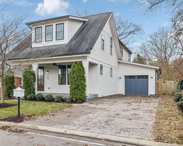 view of front of property with a porch and a garage