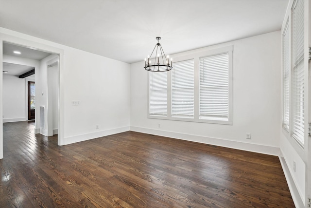 unfurnished dining area with a notable chandelier, dark hardwood / wood-style floors, and a wealth of natural light