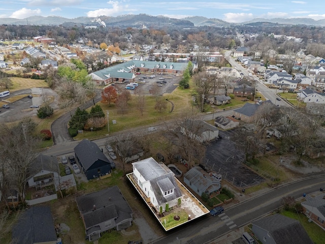 birds eye view of property with a mountain view