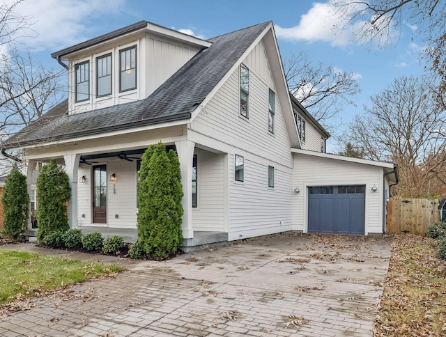 view of front of house with a porch and a garage