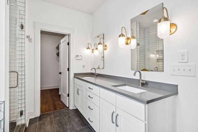 bathroom with vanity, wood-type flooring, and walk in shower