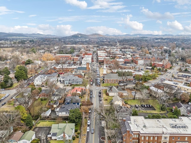 birds eye view of property with a mountain view