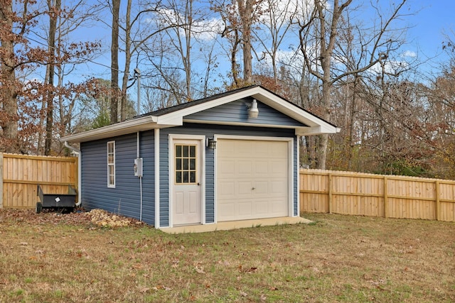 garage featuring a yard