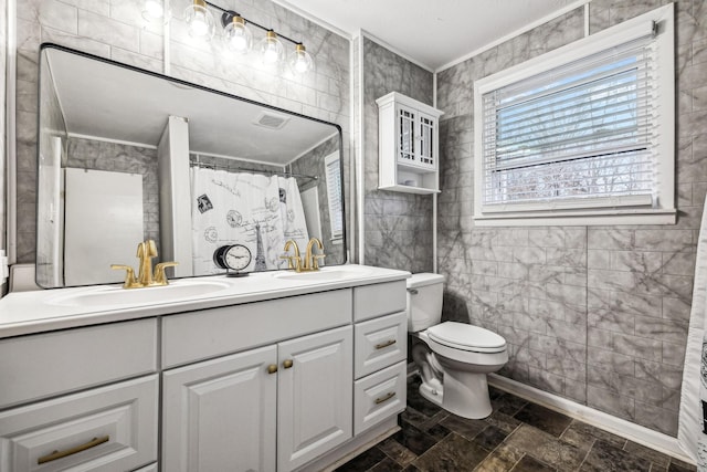 bathroom with a shower with shower curtain, ornamental molding, vanity, tile walls, and toilet