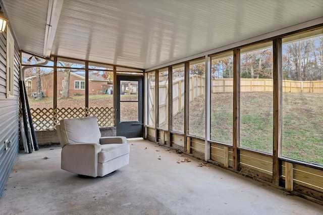 unfurnished sunroom featuring plenty of natural light