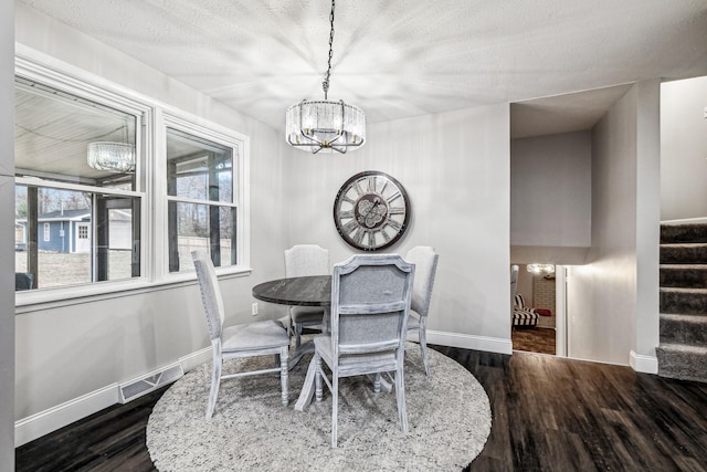 129 Dylark Dr, Waverly, TN 37185 - dining room featuring a chandelier, wood finished floors, and stairs