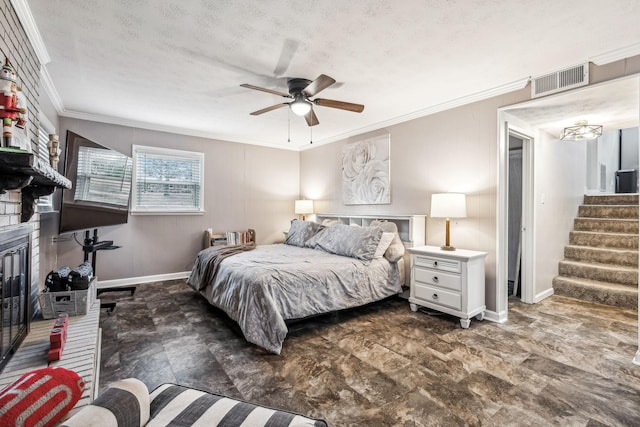 bedroom with ceiling fan, a textured ceiling, and ornamental molding