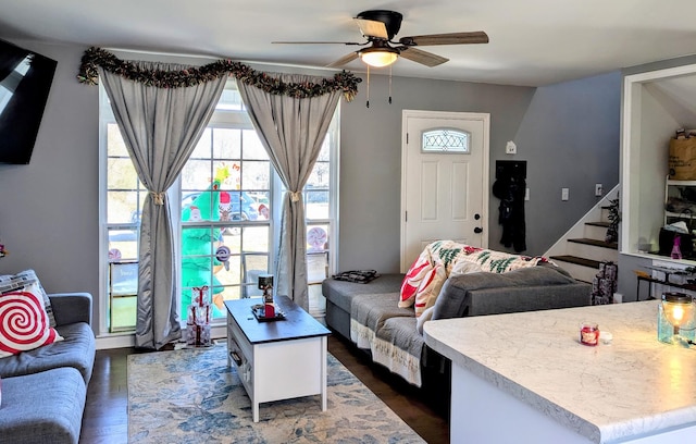 living room with ceiling fan and dark hardwood / wood-style floors