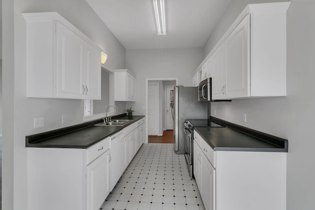 kitchen featuring white cabinetry, sink, and appliances with stainless steel finishes