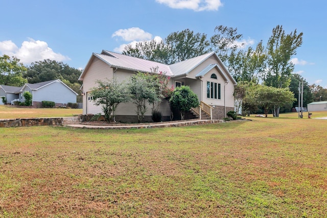 view of home's exterior with a yard