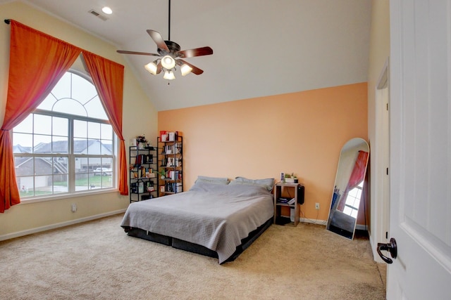 carpeted bedroom featuring a mountain view, ceiling fan, high vaulted ceiling, and multiple windows