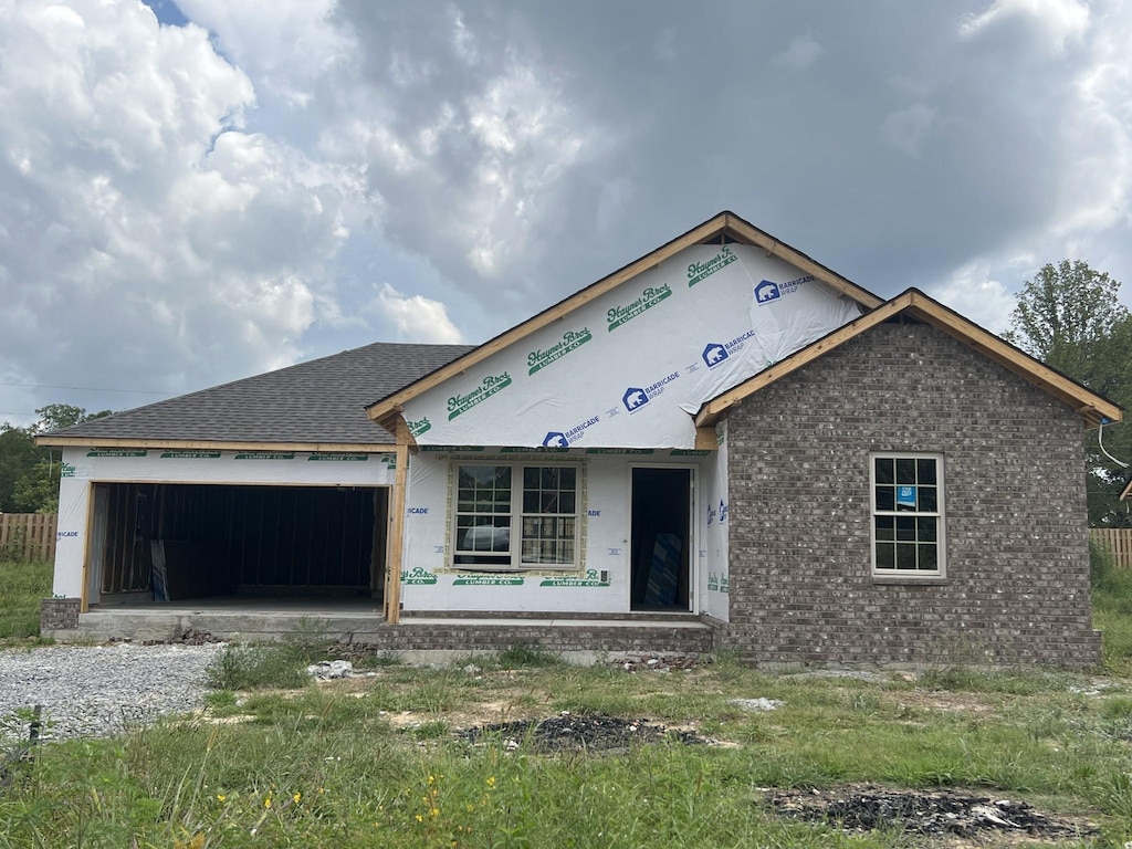 unfinished property with a garage